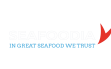 logo seafoodia in great seafood we trust avec queue de poisson rouge sur fond blanc, identité d'un client agroalimentaire de campagnes brand content south management